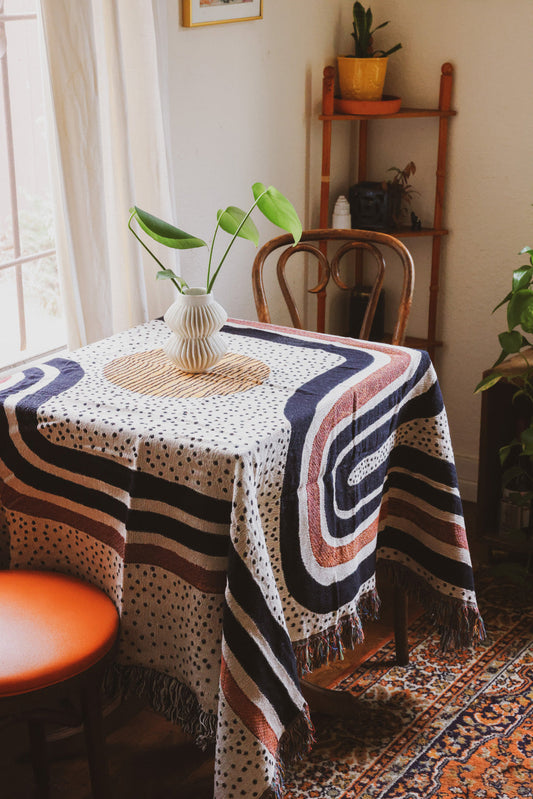quaint dining room in studio apartment with natural window late featuring table cloth used that is the Redstripe Woven Throw Blanket