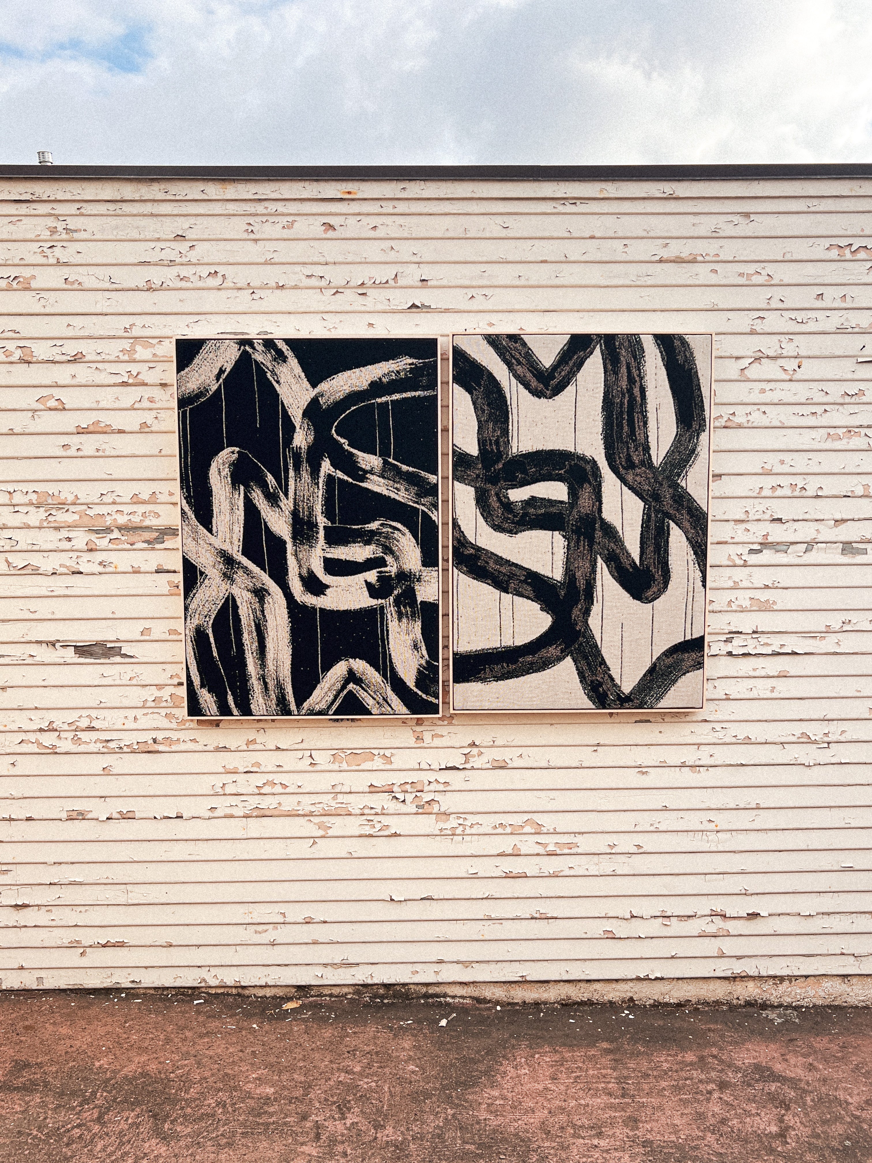 Handwoven art piece creating warmth in clean architectural setting