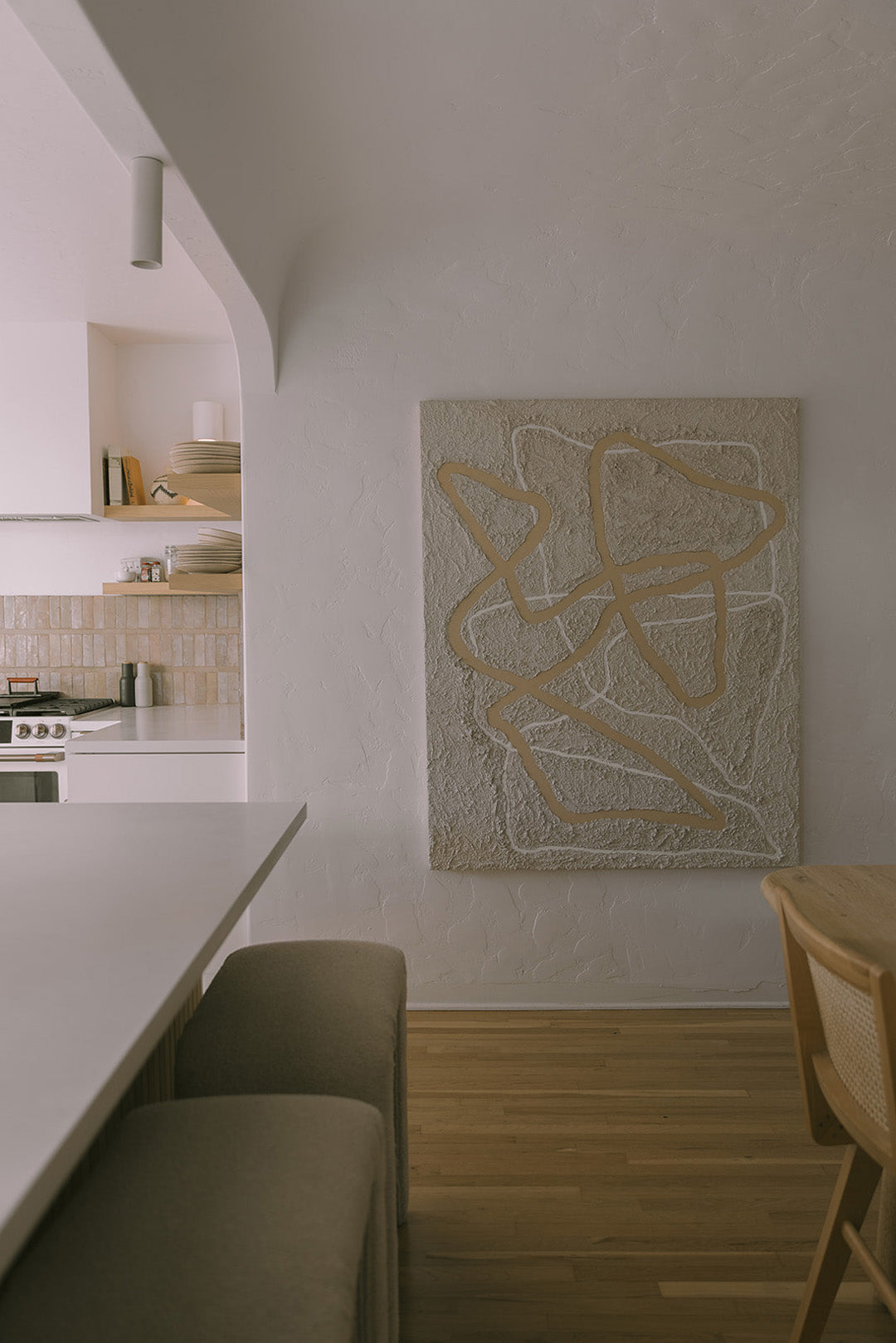 Modern home living room featured original textured abstract art by southern california artist Parker Heath. Organic design, flowing lines, neutral tones