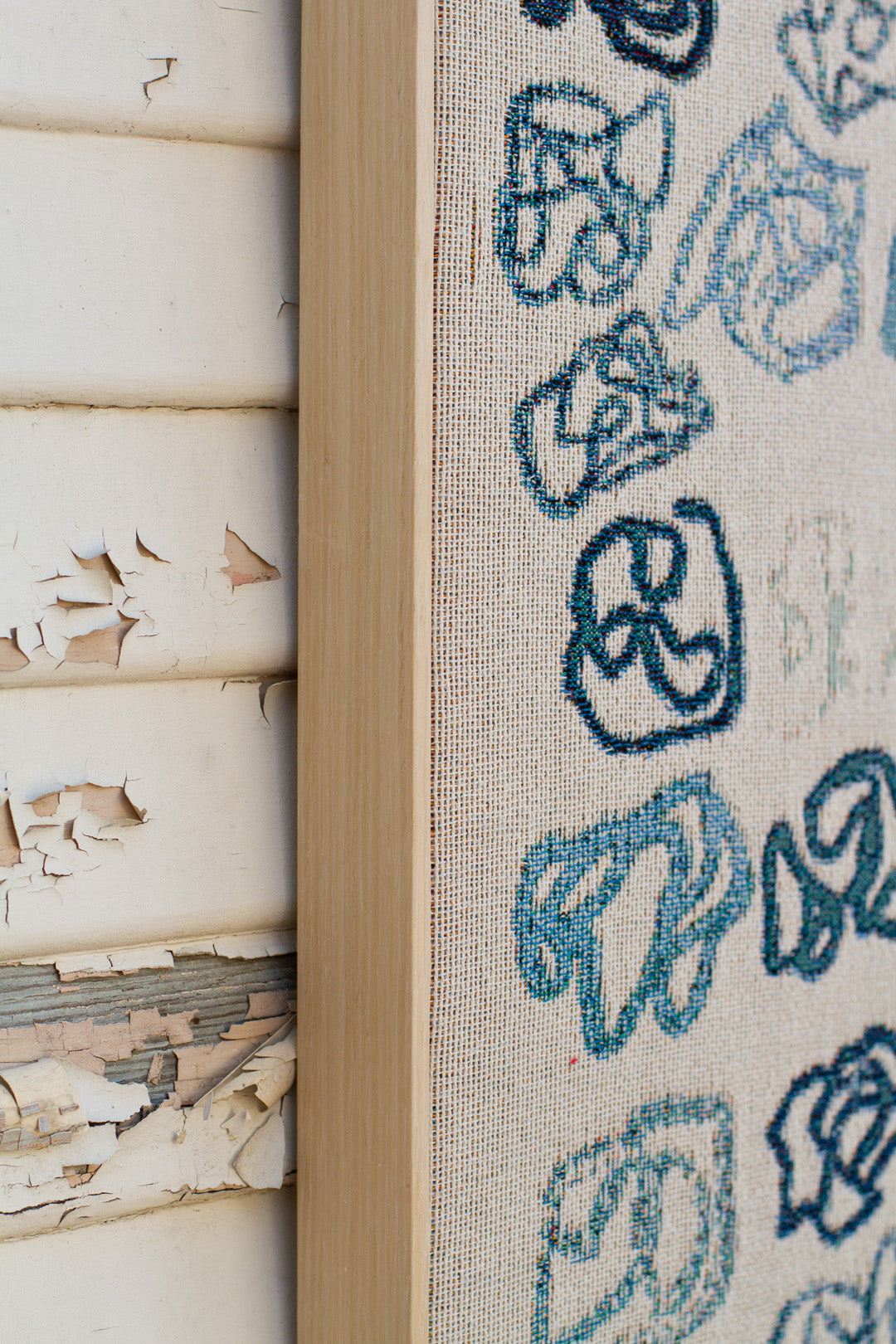 Organic linework in woven art styled on neutral-toned furniture