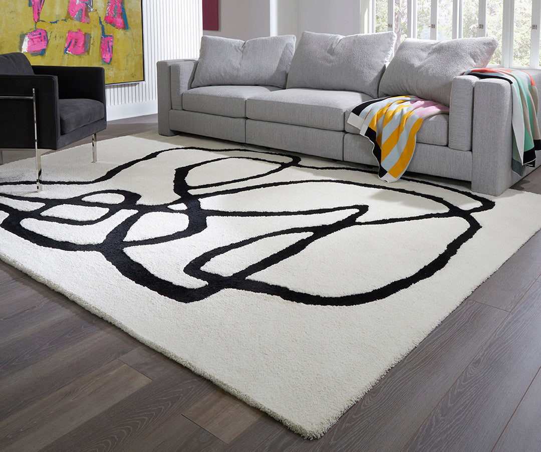 Artisan-made abstract rug from bespoke Parker Heath collection, black and white organic design